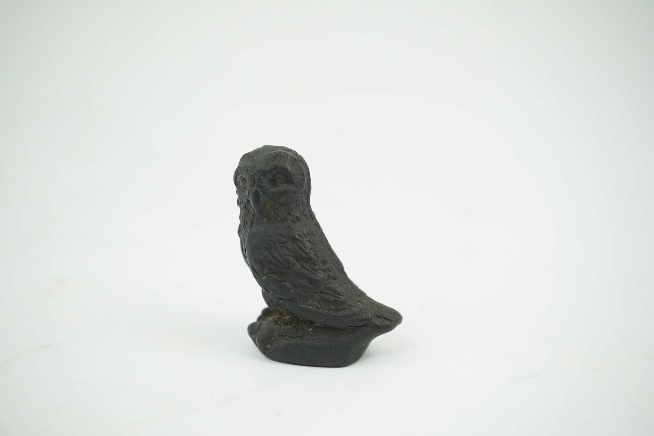 Attributed to Wedgwood, a black basalt intaglio fob seal, c.1809, modelled as an owl, inscribed ‘For further Particulars Enquire Within, 3.5cm high. Condition - good